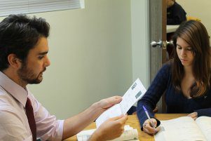 man helping girl study